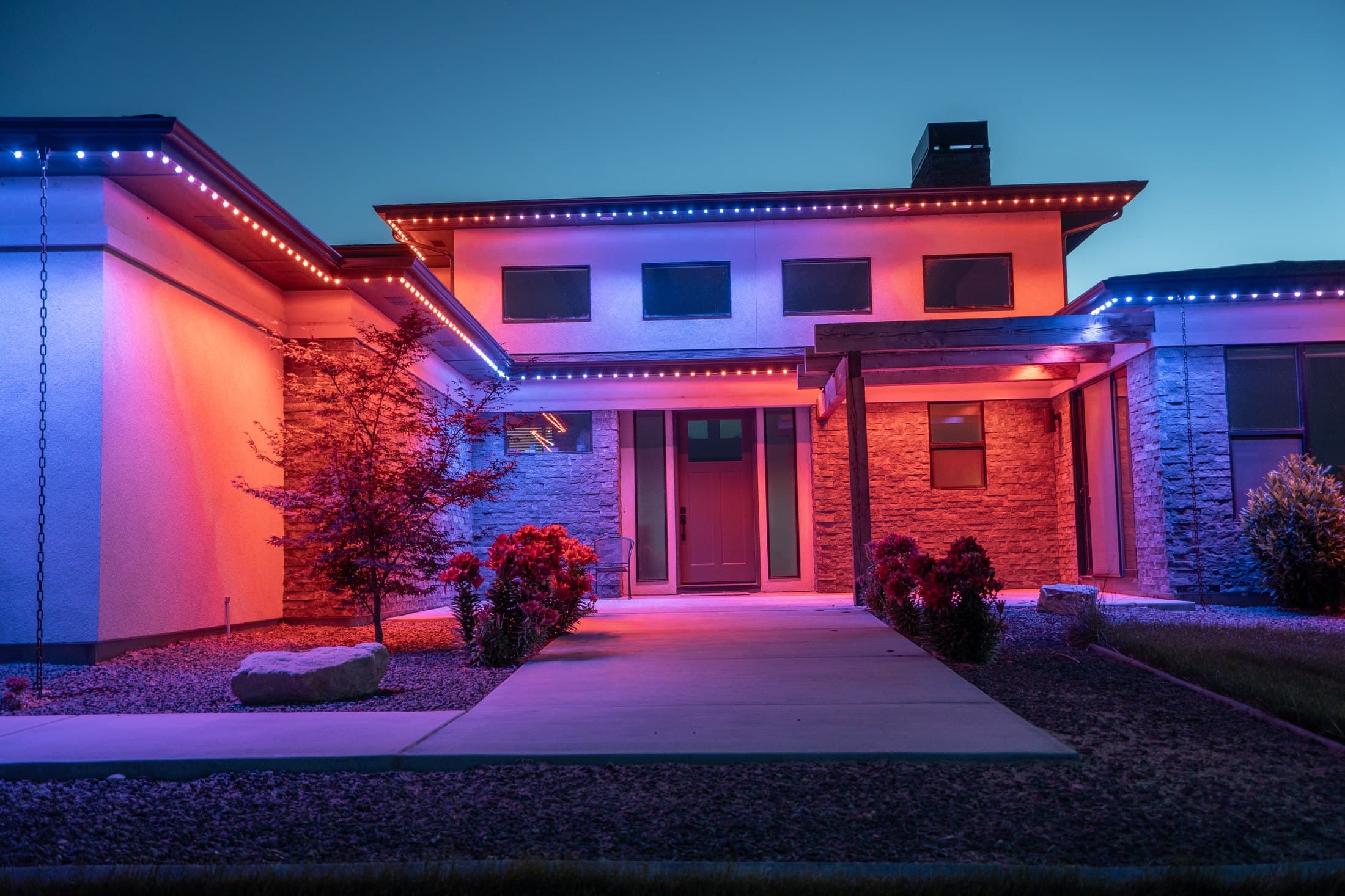 Owner-supplied Bosso lighting installation with red, blue, and violet holiday colors