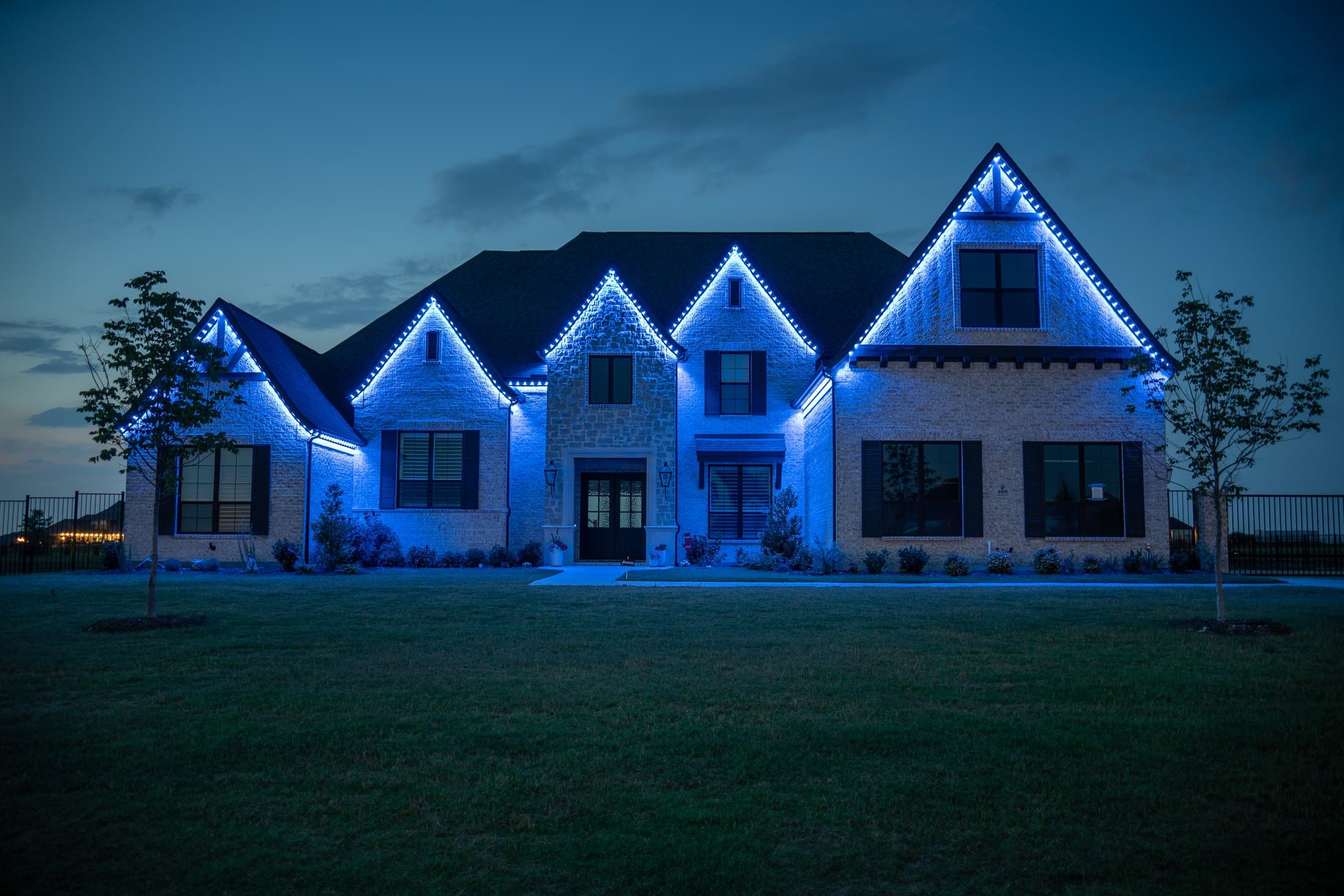 Owner-supplied Bosso lighting installation with vivid purple roofline lights